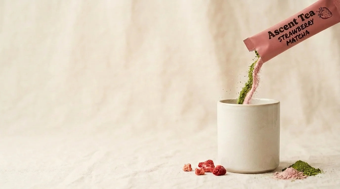 Matcha being poured into a glass on linen background